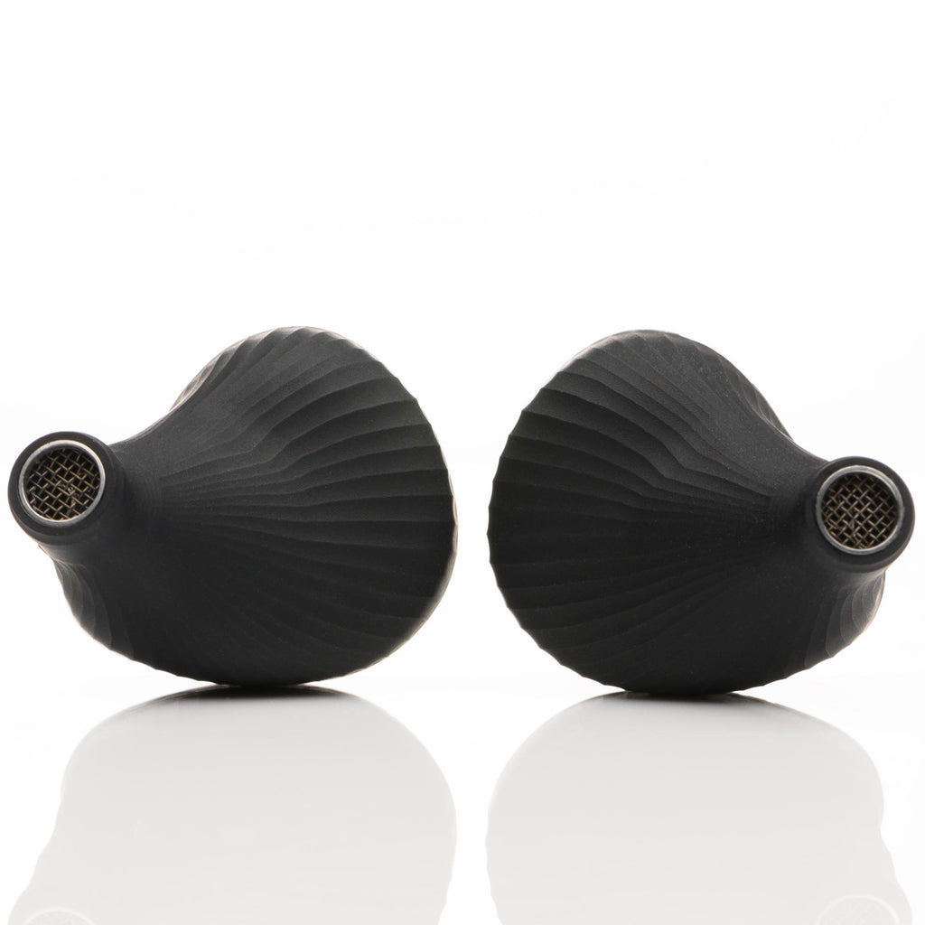 Close-up of black Noble Audio Viking Ragnar Universal-Fit IEM earpieces displaying textured matte finish on white background