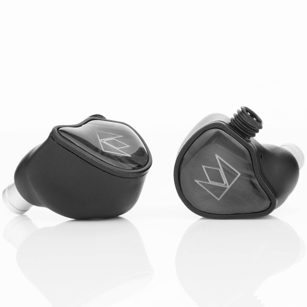 Close-up of black Noble Audio XM-1 IEM with xMEMS Driver in-ear monitors showing logo on smooth glossy surface