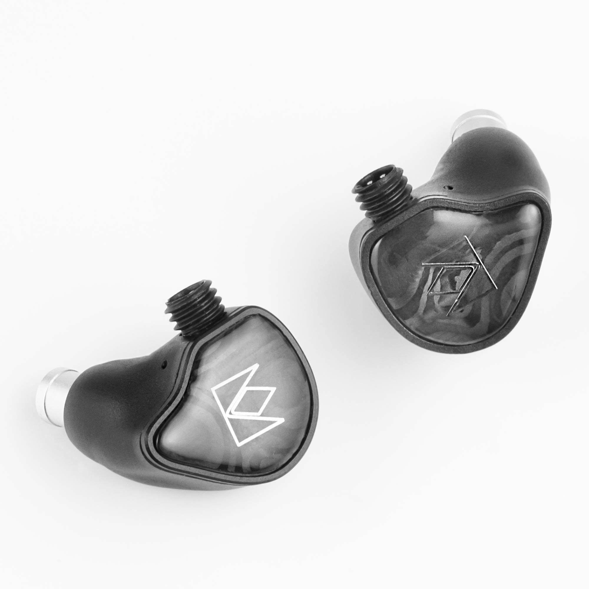 Noble Audio XM-1 IEM with xMEMS Driver in-ear monitors with glossy black faceplates and logo detailing on white background