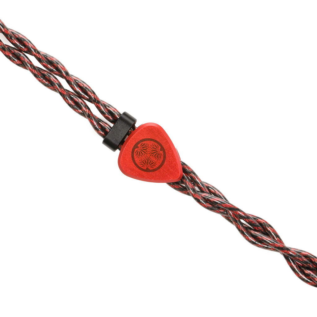 Close-up of the red cable cinch with black and red braided cable of the Noble Audio Shogun IEM on white background