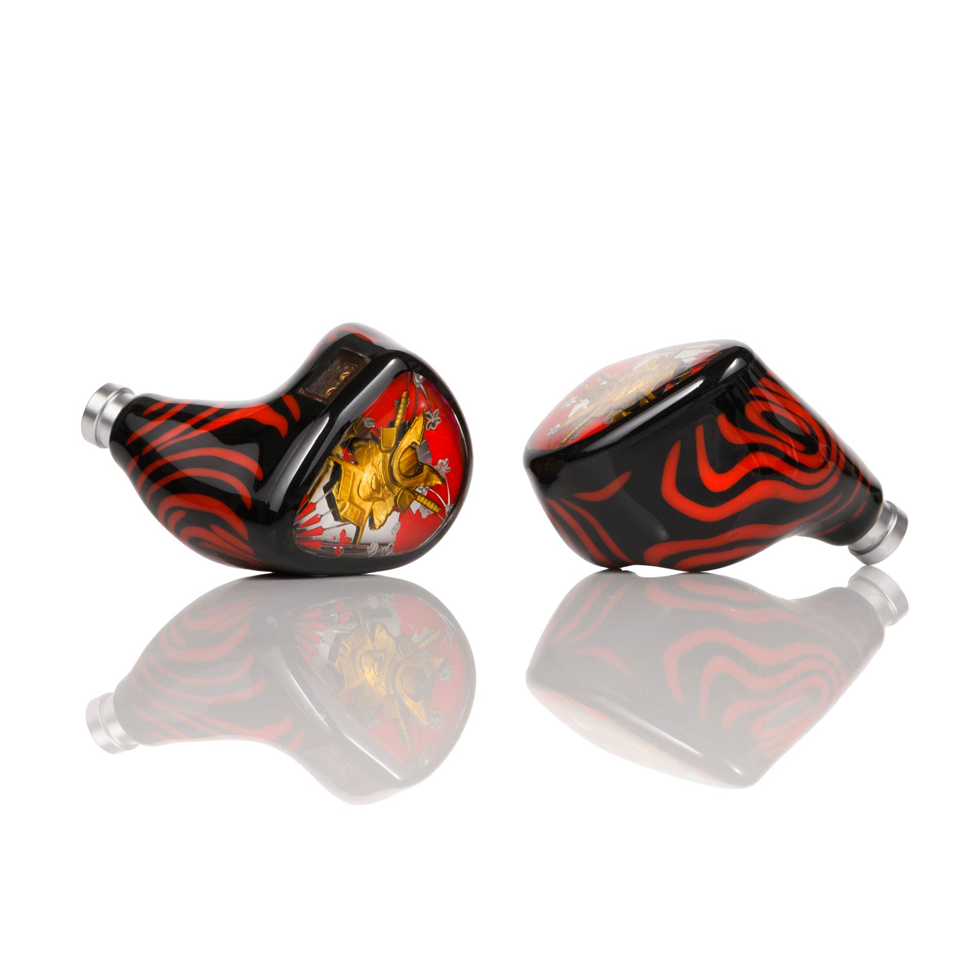 Noble Audio Shogun IEMs with black and red tiger stripe design and detailed gold emblem on reflective white surface