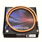 Portento Audio USB Copper Signature Upgrade Digital Cable coiled on branded black box, gold plated connectors visible