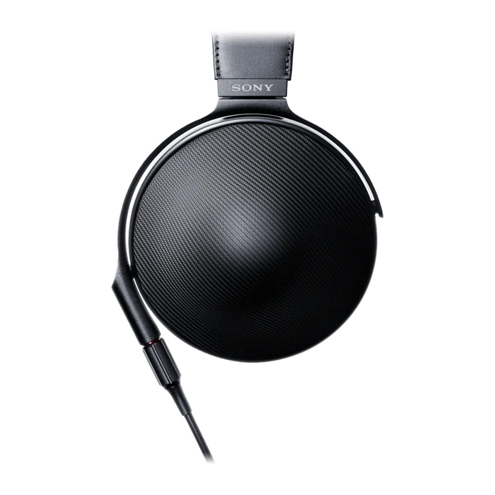 Close-up side view of Sony MDR-Z1R Closed Back Headphones with textured ear cup and detachable cable on white background