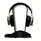 Spirit Torino Radiante Closed-Back (Pre-Owned) headphones displayed on a wooden headphone stand with cable attached