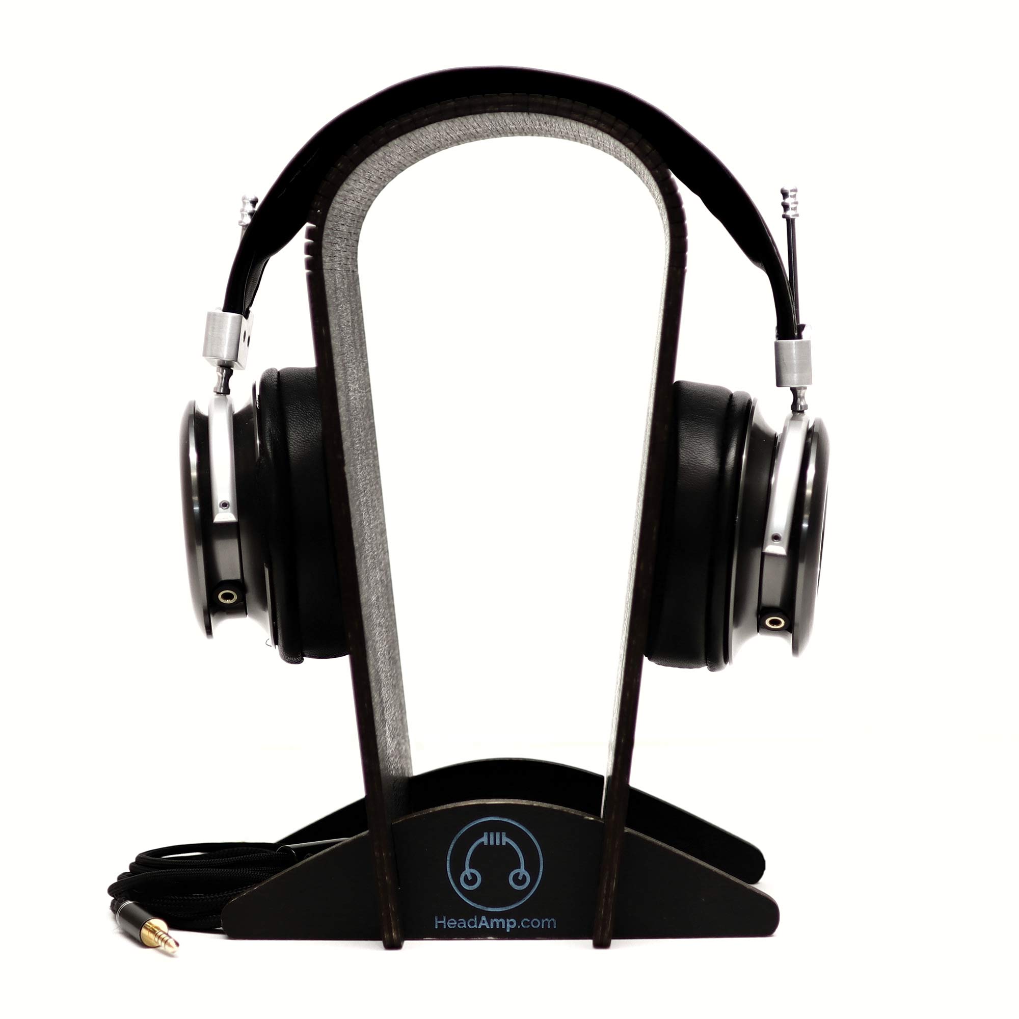 Spirit Torino Radiante Closed-Back (Pre-Owned) headphones displayed on a wooden headphone stand with cable attached