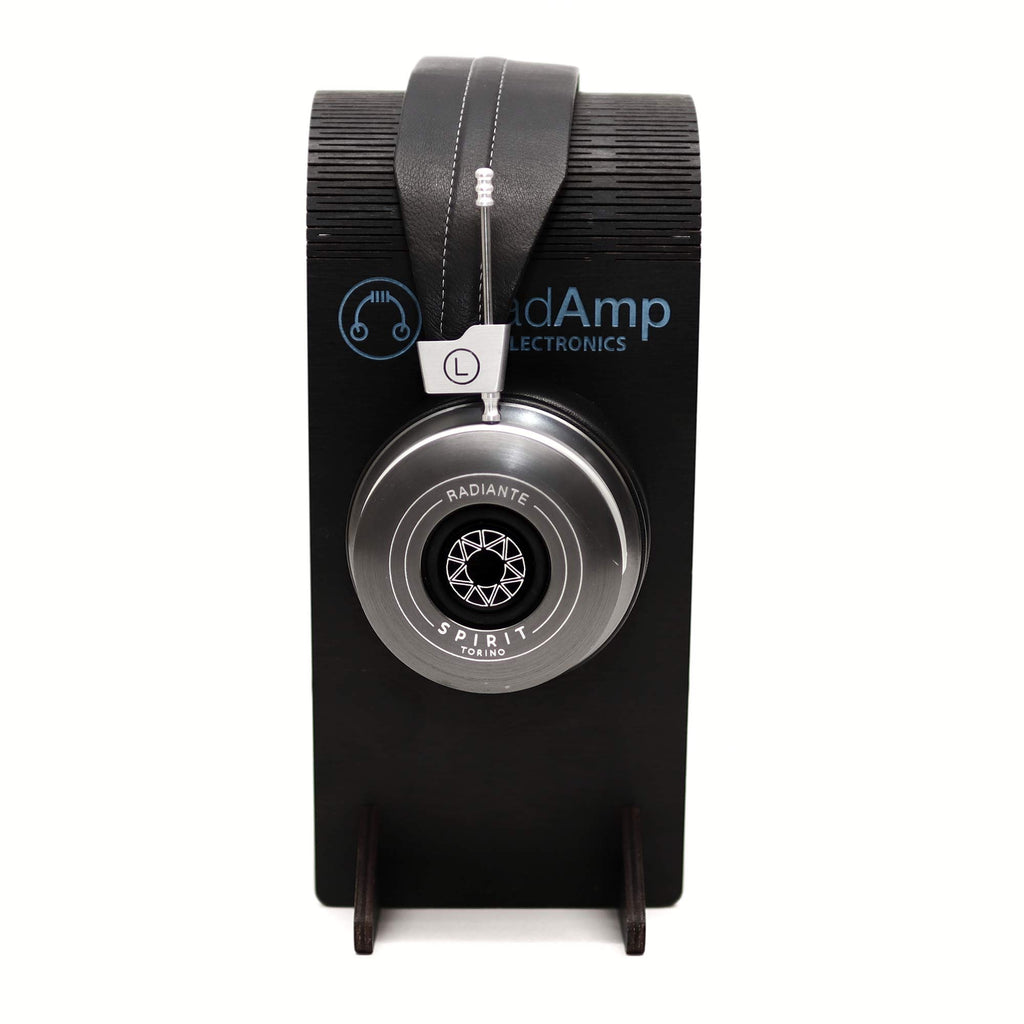 Spirit Torino Radiante Closed-Back (Pre-Owned) headphones hanging on black stand, showing left earcup and simple retro design