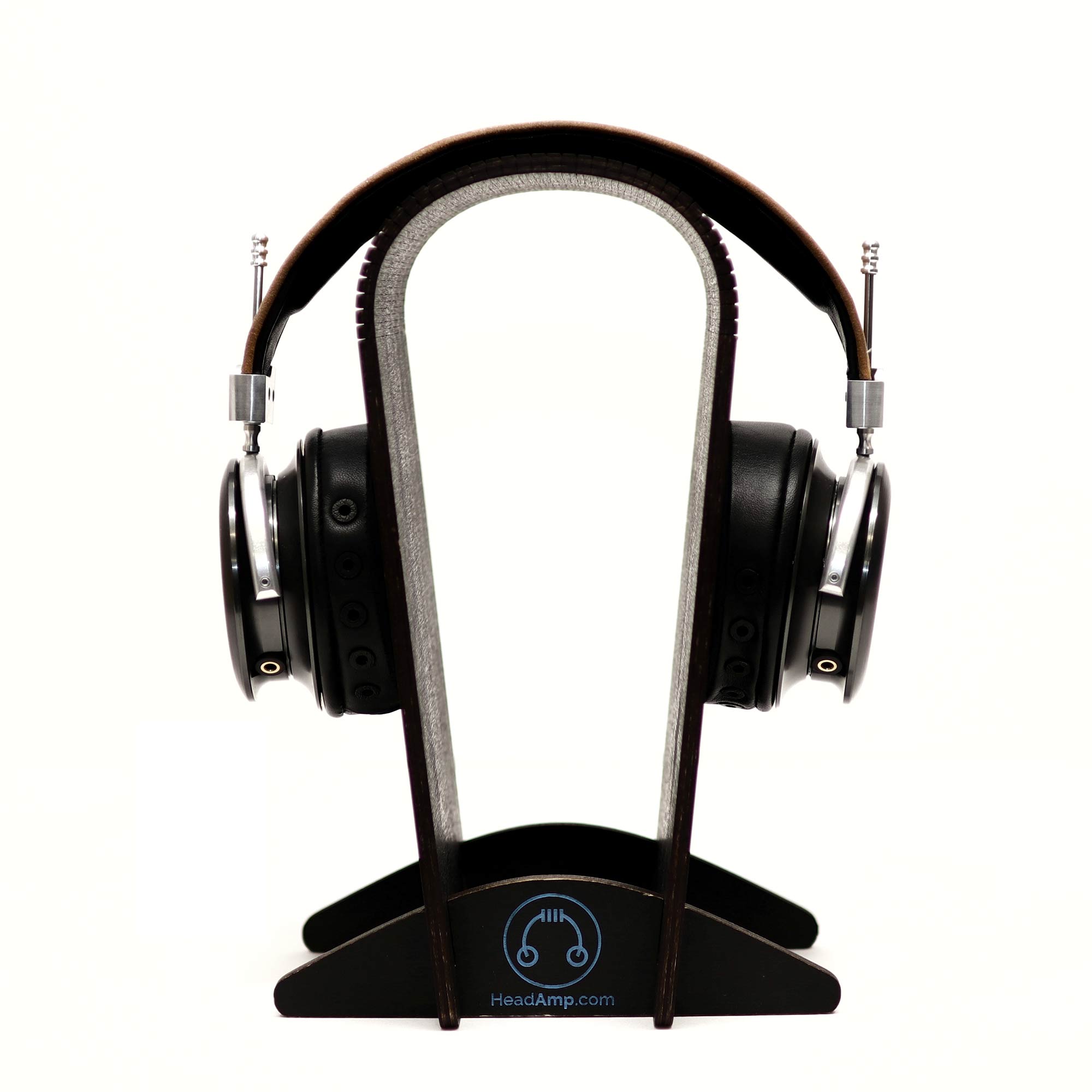 Spirit Torino Titano semi-closed headphones displayed on wooden stand against white background