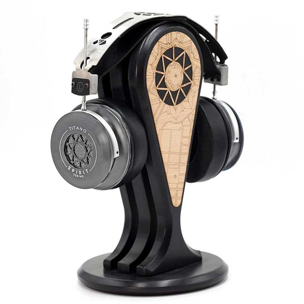 Spirit Torino Titano semi-closed back headphones displayed on a black wooden headphone stand with engraved design