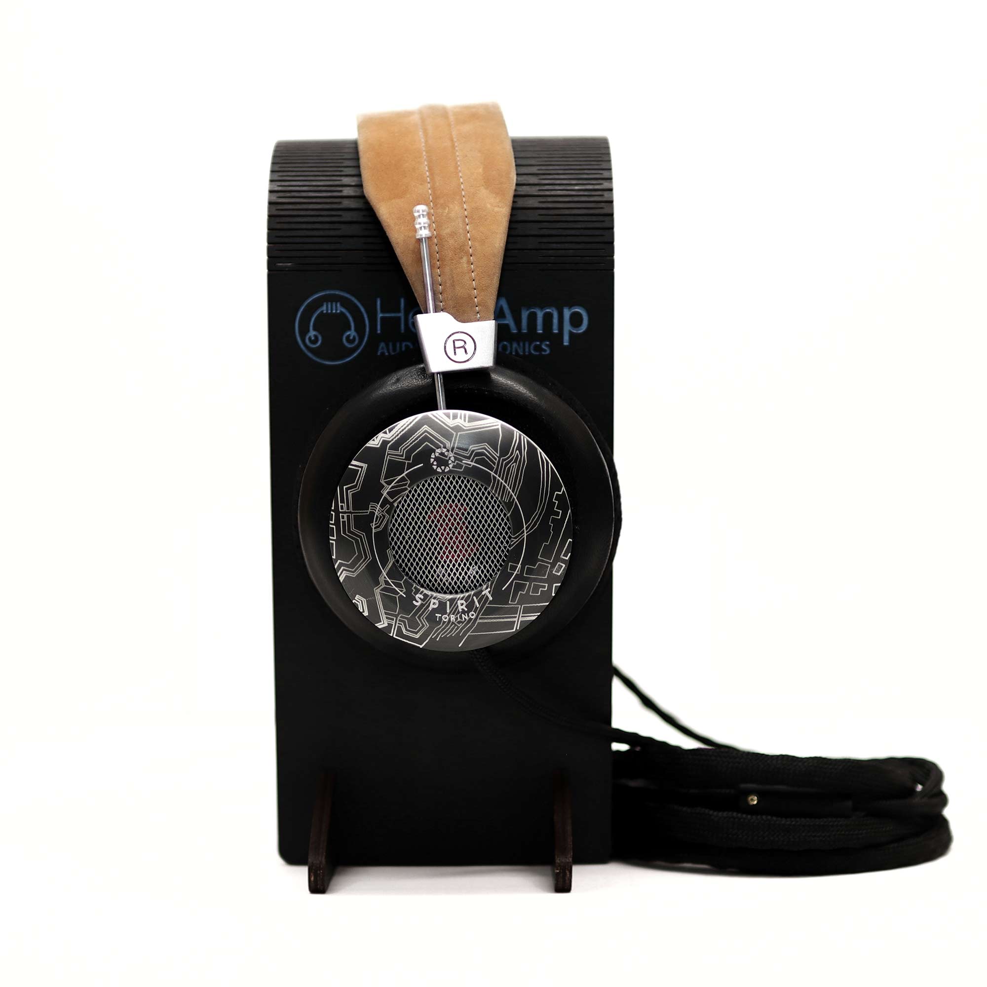 Spirit Torino Twin Pulse 1706 open back headphones with tan headband resting on a black headphone stand with cable coiled below