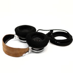 Spirit Torino Twin Pulse 1706 open back headphones with black ear pads and brown leather headband on white background