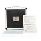 STAX SR-4070 Closed-Back Electrostatic Headphone (Pre-Owned) carrying case with user manual and frequency response sheet on white background