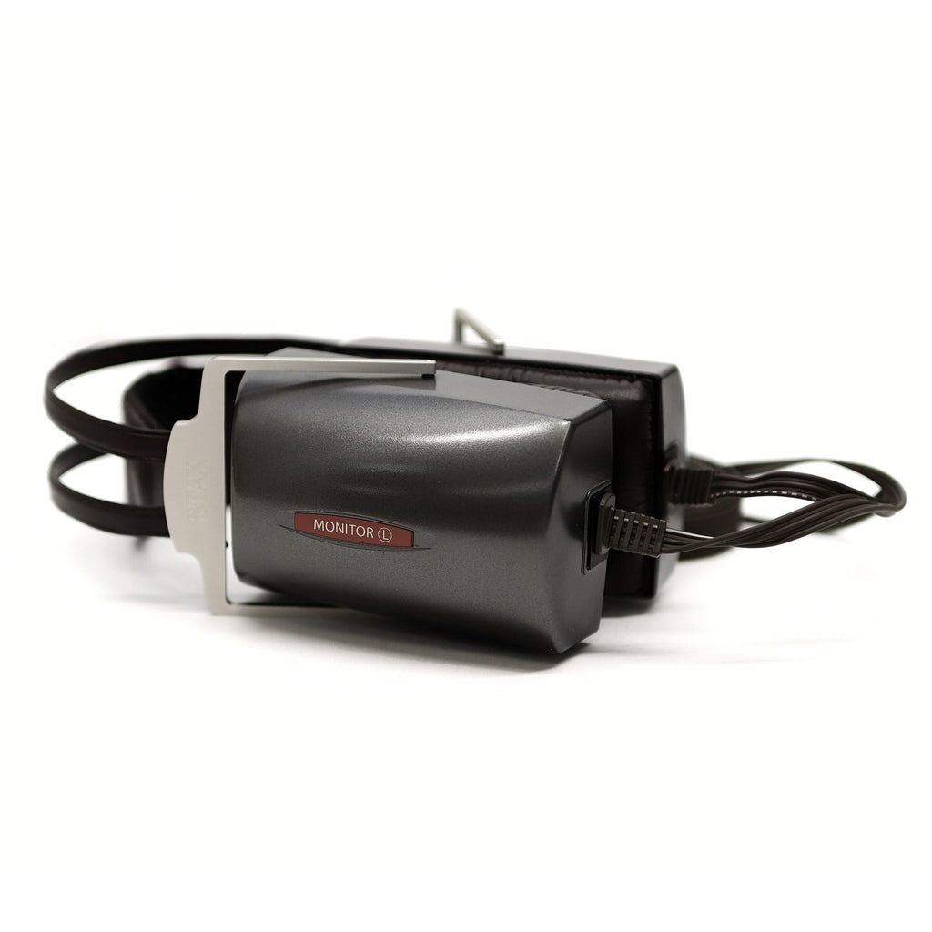 STAX SR-4070 Closed-Back Electrostatic Headphone (Pre-Owned) lying on white background showing closed ear cups and headband details