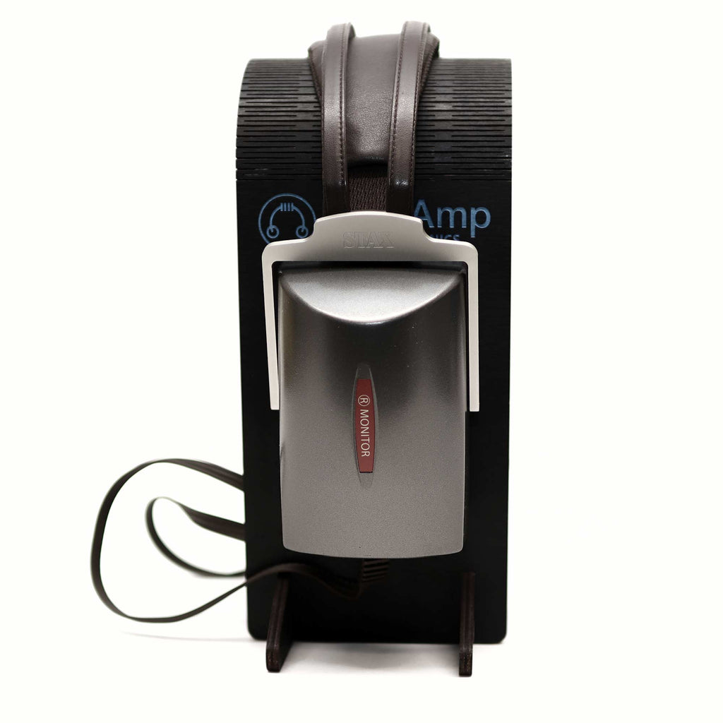 STAX SR-4070 Closed-Back Electrostatic Headphone (Pre-Owned) on black headphone stand with attached cable on white background