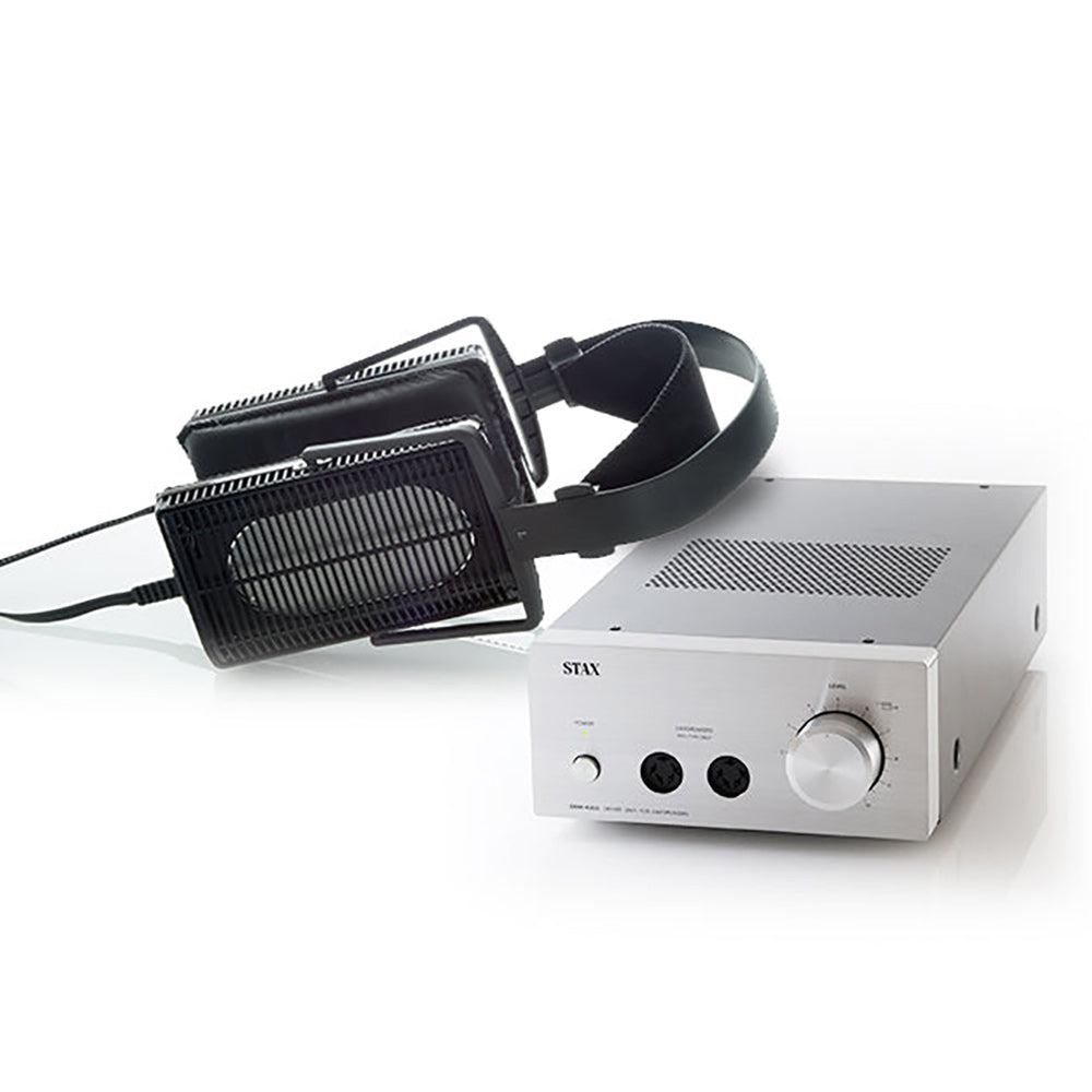 STAX SR-L300 + SRM-400S Bundle showing electrostatic headphones resting next to silver amplifier on white surface