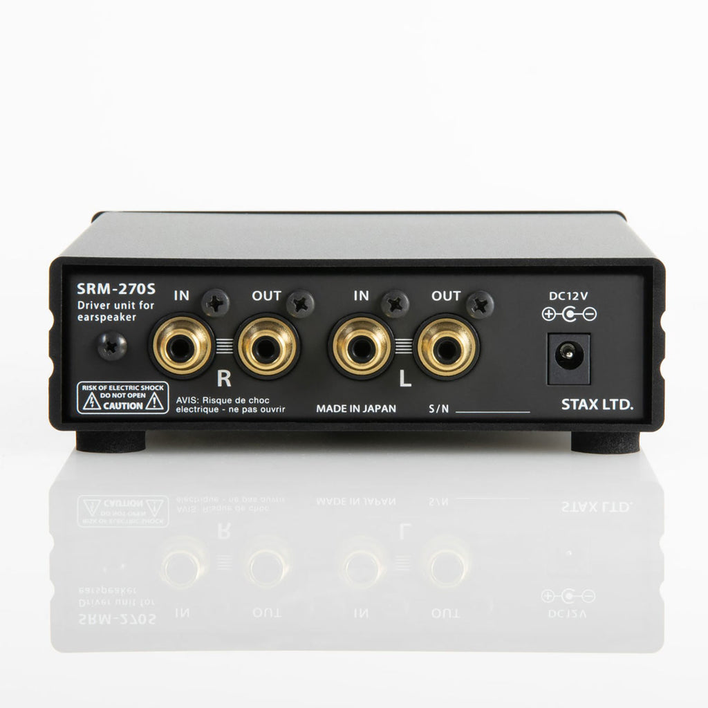 Rear view of STAX SRM-270S Electrostatic Driver Unit showing input and output RCA connectors and power port on white surface