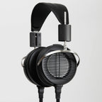 STAX SRS-X1000 Electrostatic Earspeaker System with black ear cups, metal frame, and dual cables on gray background