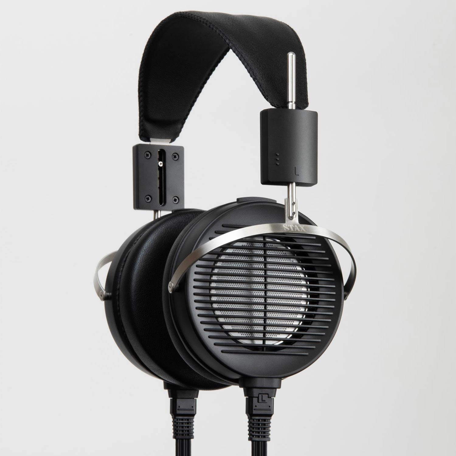 STAX SRS-X1000 Electrostatic Earspeaker System with black ear cups, metal frame, and dual cables on gray background
