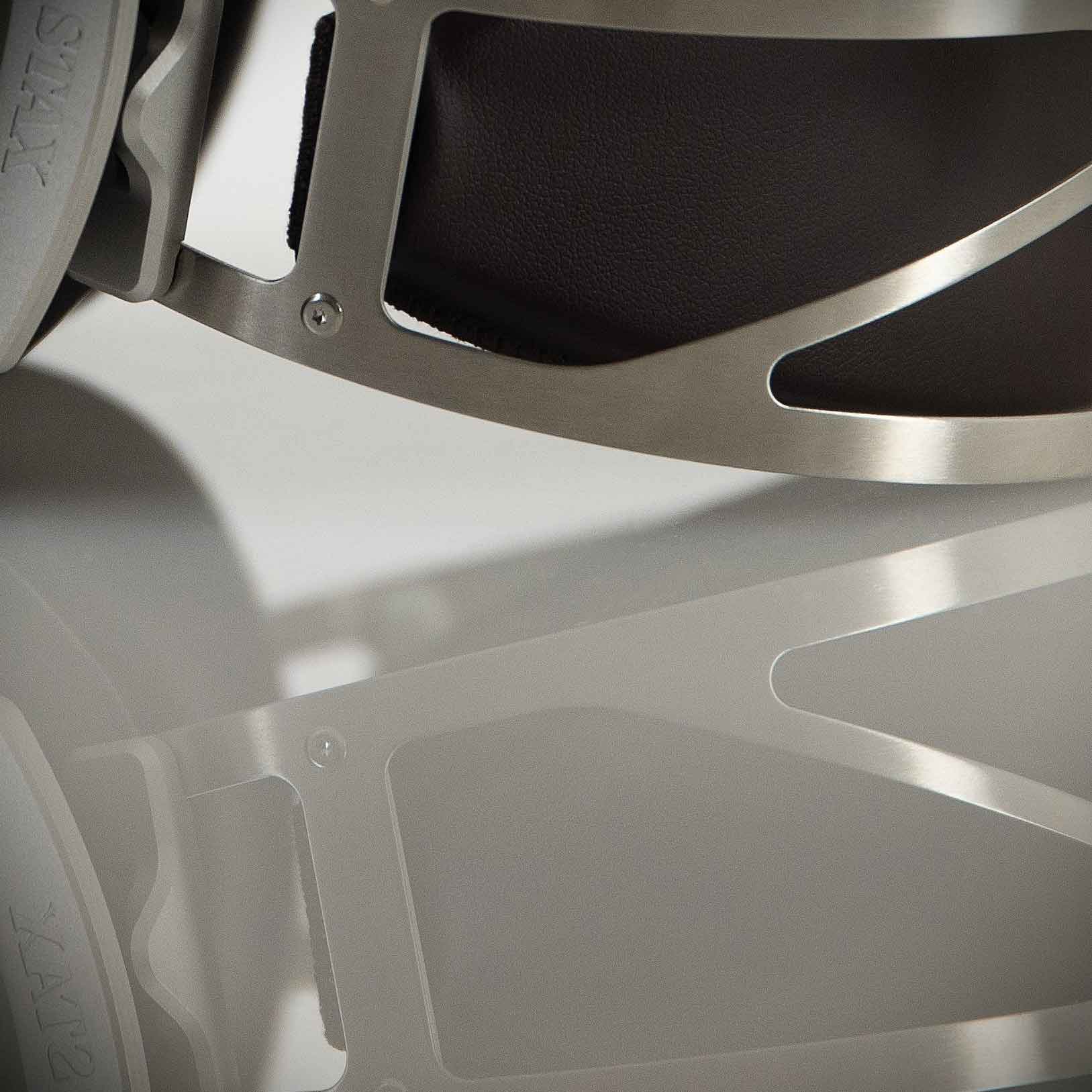 Close-up of STAX SR-007S Electrostatic Headphones metal headband and reflection on a light surface