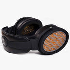 Warwick Acoustics APERIO Electrostatic Earspeaker System with black headband and orange patterned ear cups on white background