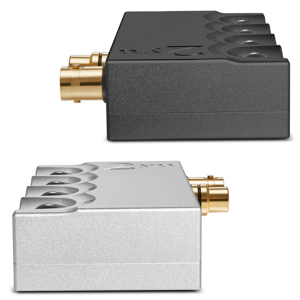 Side view of two Chord 2yu Music Streamer units in black and silver with gold audio connectors on white background