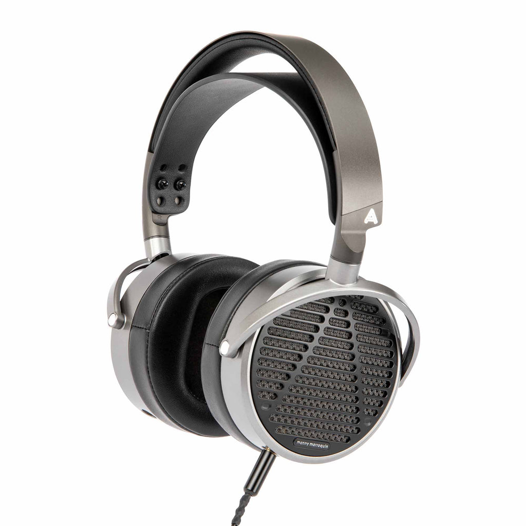Audeze MM-100 open back planar magnetic headphones in silver and black with padded ear cups on white background