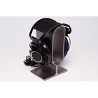 Sony Qualia 010 Reference Headphone with rare blue ear cups displayed on a modern black headphone stand