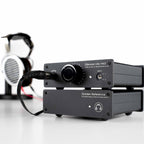 HeadAmp Gilmore Lite Mk2 Class-A Headphone Amplifier with Golden Reference power supply and connected headphones on white surface