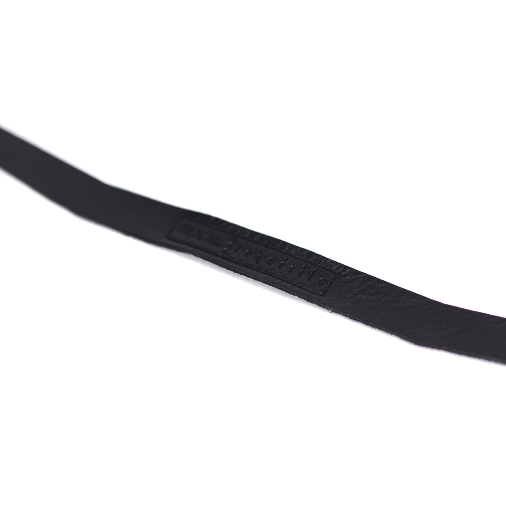 Close-up of RAAL-requisite Leather Headstrap Replacements for SR1 showing black leather strap with embossed branding on white background