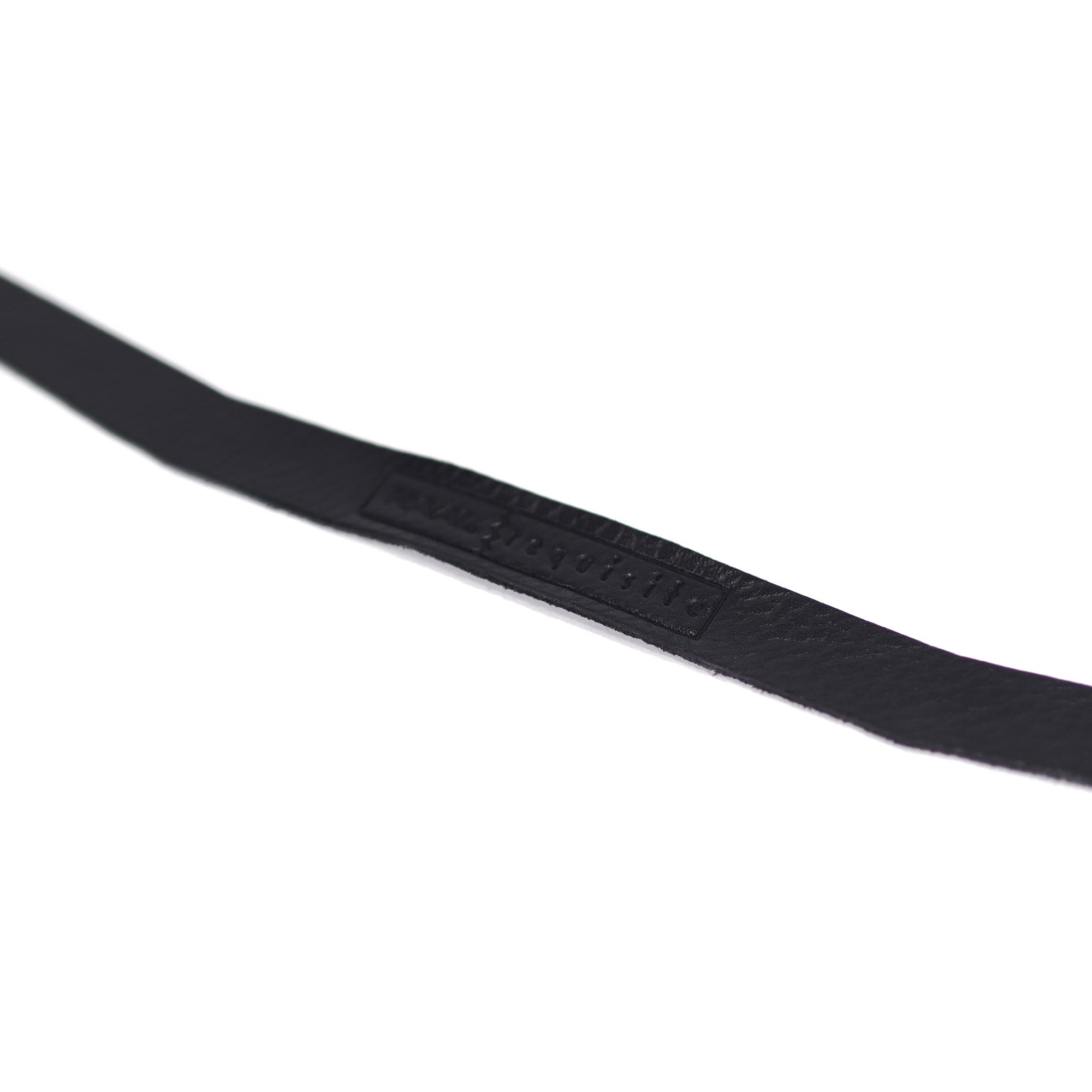 Close-up of RAAL-requisite Leather Headstrap Replacements for SR1 showing black leather strap with embossed branding on white background