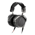 Audeze MM-500 planar magnetic open back headphones with black leather headband and detachable cables on white background