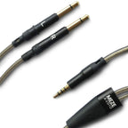 Close-up of Meze 99 Series OFC Balanced Upgrade Headphone Cable with gold-plated connectors and transparent wiring sheath