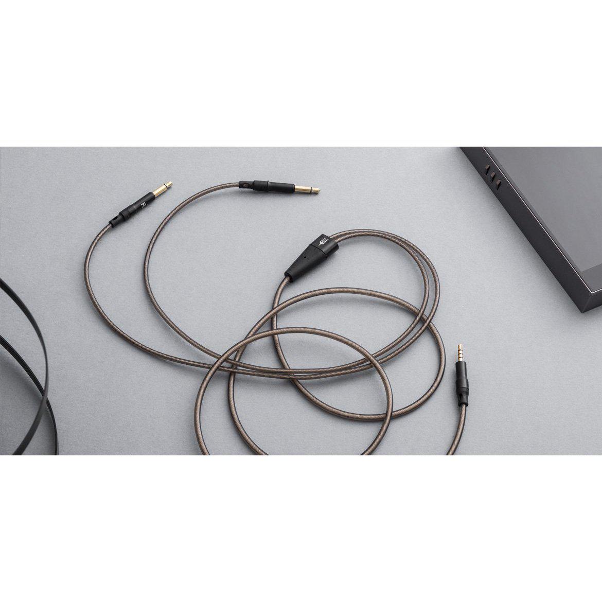 Meze 99 Series OFC Balanced Upgrade Headphone Cable with black connectors and braided silver-plated wire on gray surface
