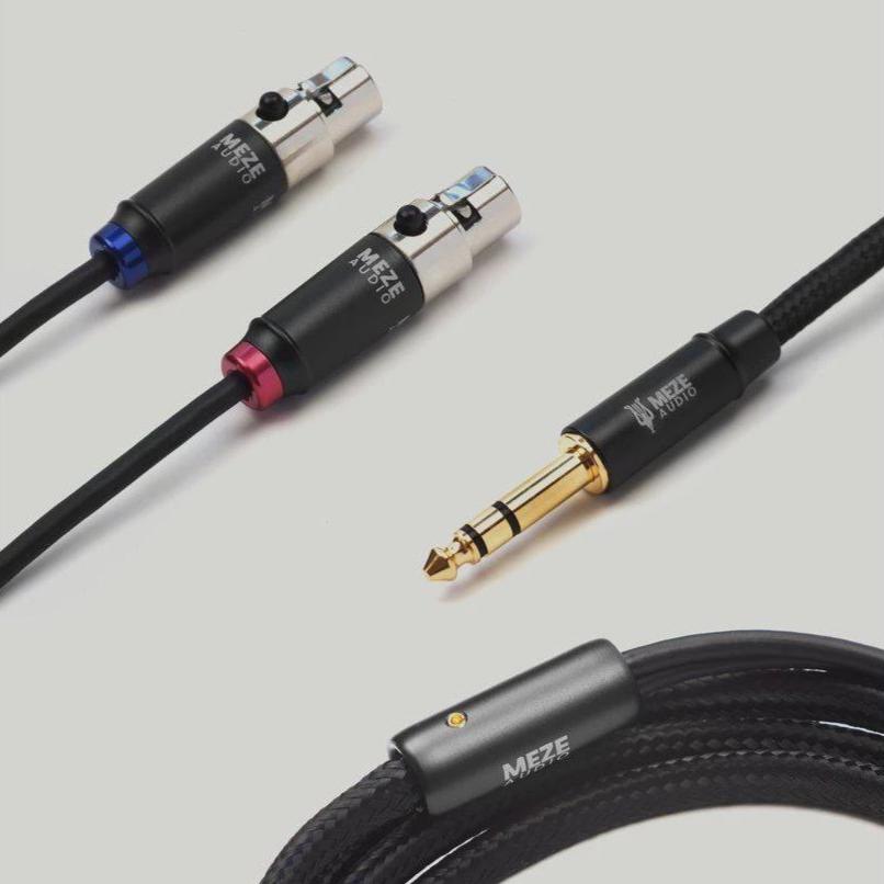 Close-up of Meze Empyrean Standard Headphone Cables with XLR connectors and 6.3mm gold-plated jack on light background