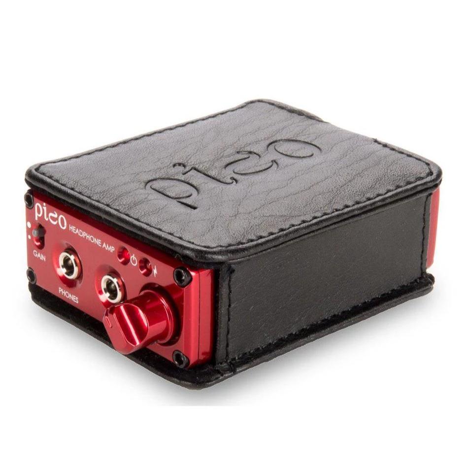 HeadAmp Pico Portable Headphone Amplifier in black leather case with red metal front panel and volume knob close-up view
