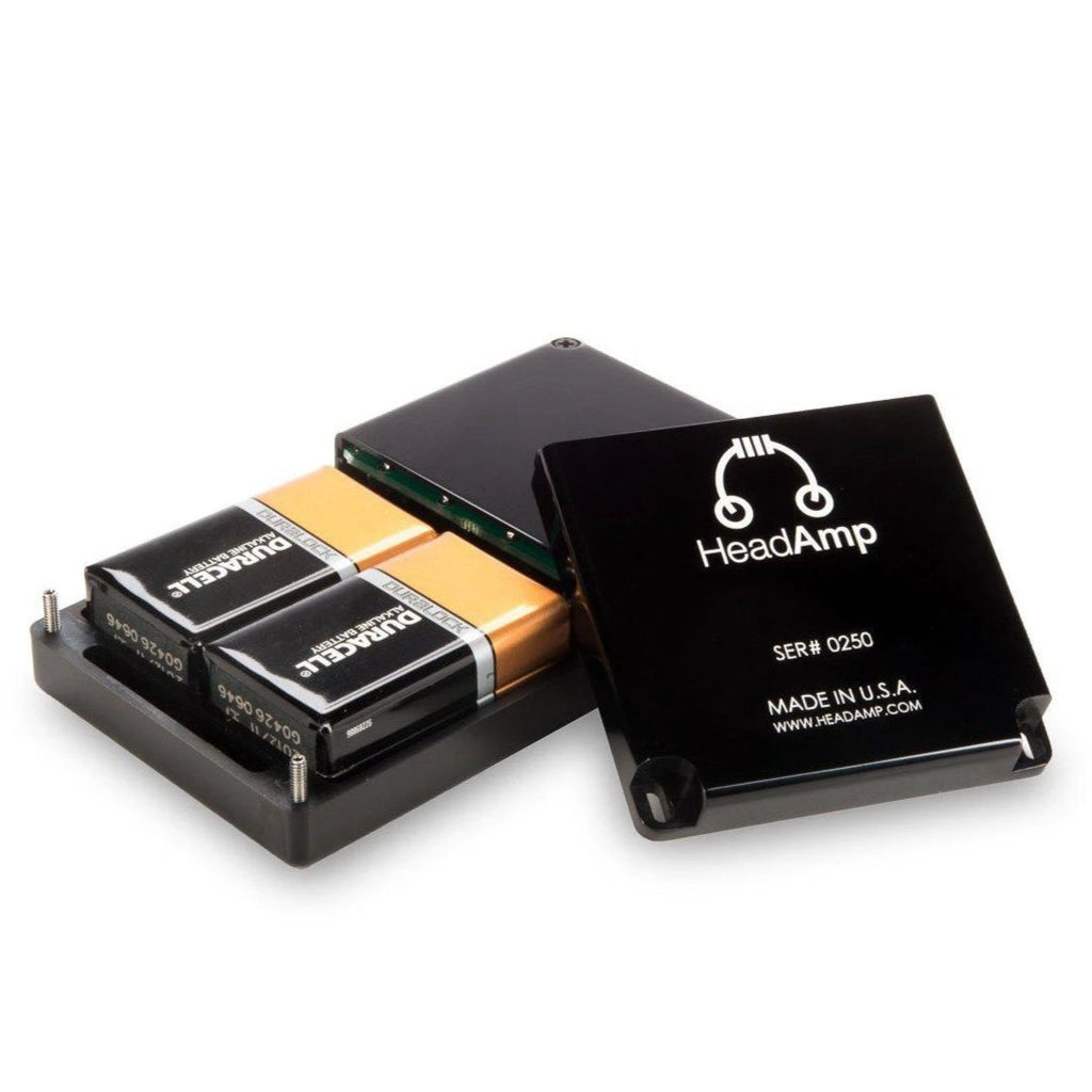 HeadAmp Pico Power Portable Headphone Amplifier with open case showing two 9V batteries and black cover on white background