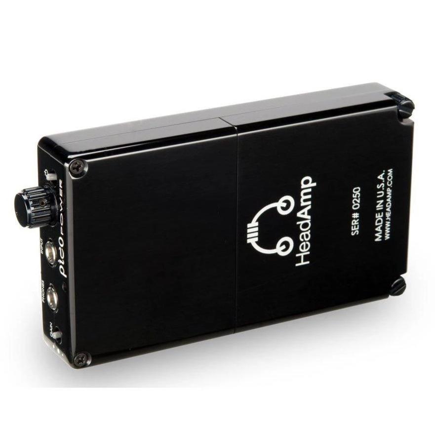 Closed view of the black HeadAmp Pico Power Portable Headphone Amplifier showing volume knob and input jacks on white background