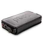HeadAmp Pico Slim Portable Headphone Amplifier in black leather case with volume knob and headphone jack visible