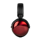 Close-up of HIFIMAN HE-R9 Wireless | Dynamic Closed Back headphone ear cup with glossy red finish and black padded headband