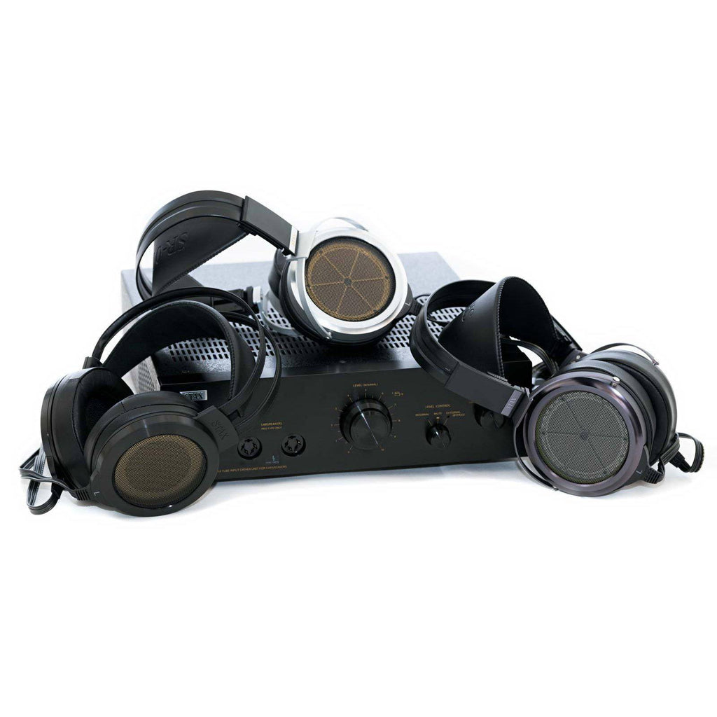 STAX SRM-T8000 electrostatic headphone amplifier with three pairs of electrostatic headphones against white background