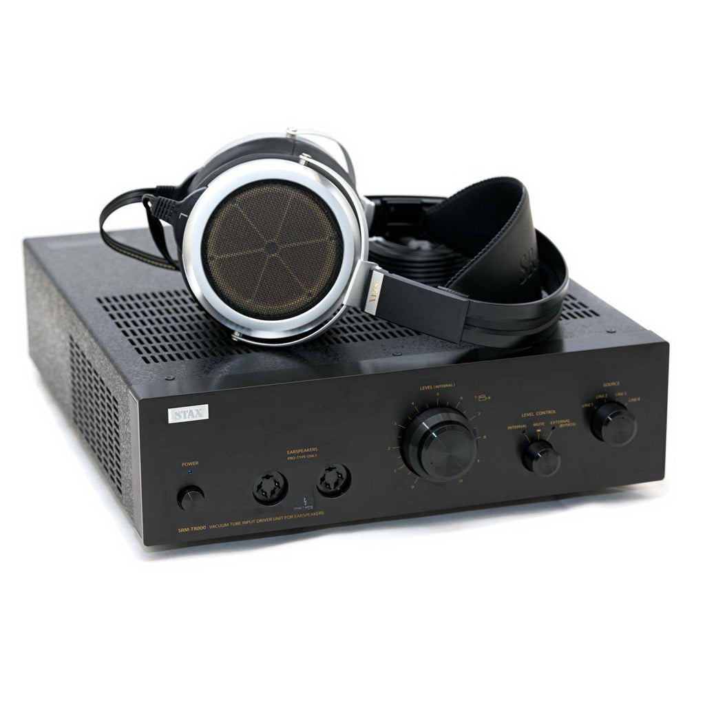 STAX SRM-T8000 electrostatic headphone amplifier with headphones resting on top, black design with control knobs