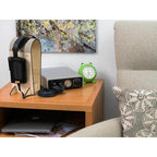 STAX SRM-D50 Electrostatic Headphone Amplifier / DAC on wooden table next to headphones and green frog alarm clock