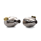 Close-up of Campfire Solaris 'Stellar Horizon' in-ear monitors with silver housing and gold connector on white background