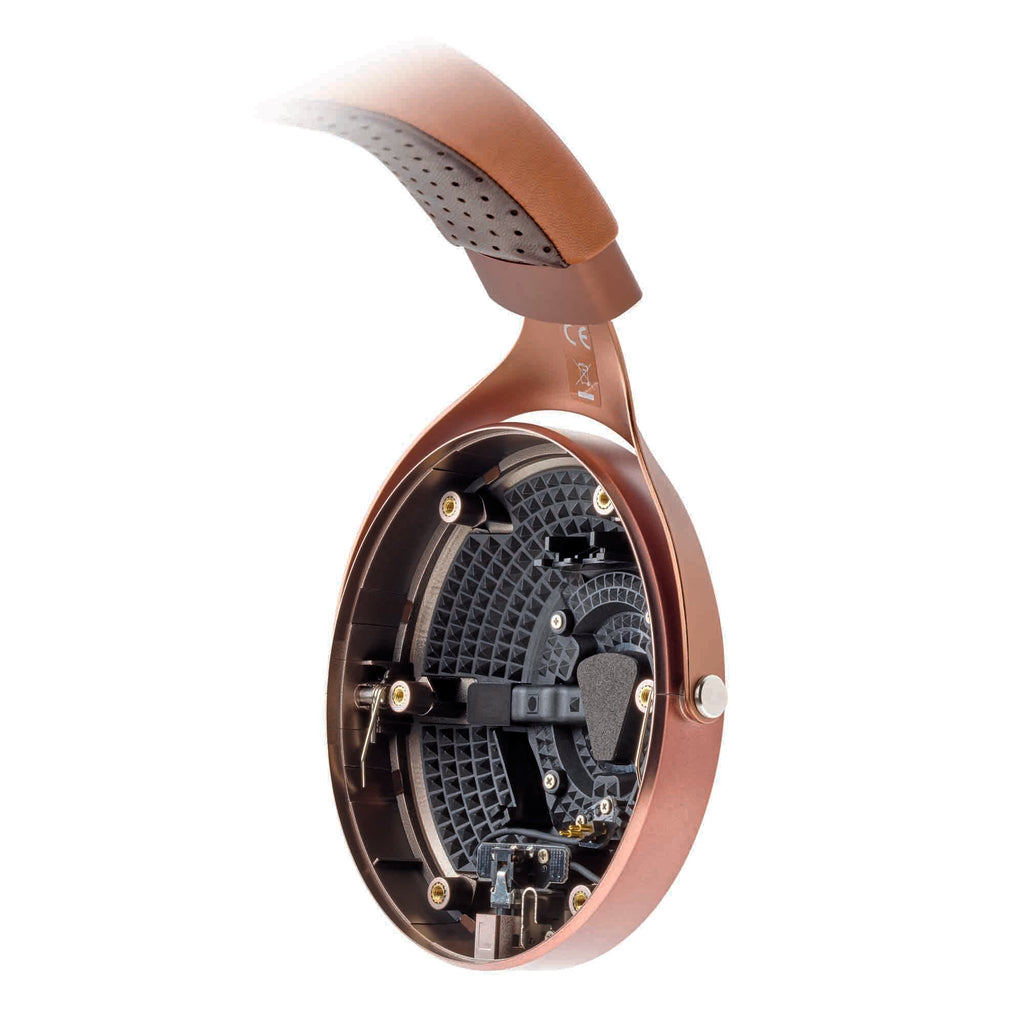 Close-up of the Focal Stellia Closed-Back Dynamic Headphones showing the internal driver and copper-colored ear cup detail