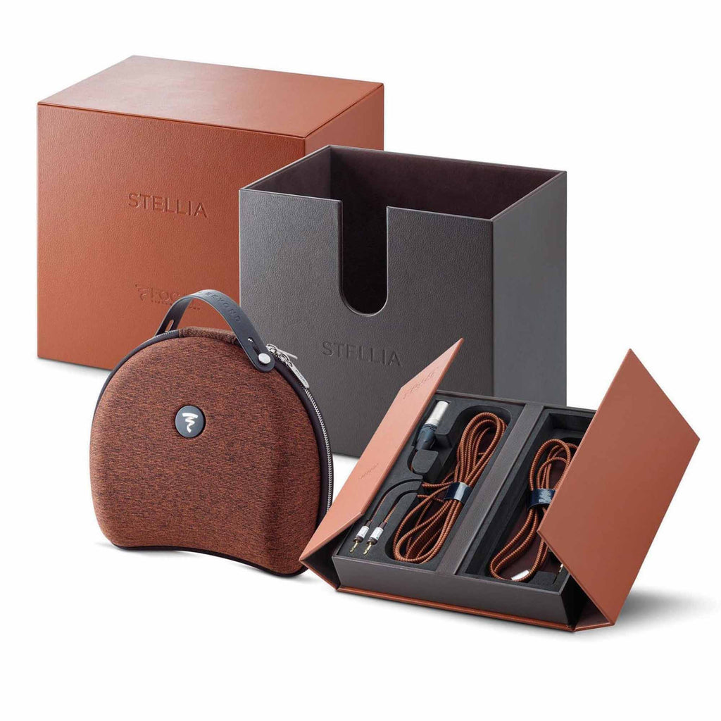 Focal Stellia Closed-Back Dynamic Headphones packaging showing carrying case, cables, and opened storage box on white background
