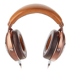 Focal Stellia Closed-Back Dynamic Headphones with brown leather headband and cushioned ear cups on white background