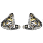 Pair of transparent Campfire Trifecta - Flagship IEMs showing internal gold and silver components on white background