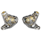 Pair of transparent Campfire Trifecta - Flagship IEM with visible internal gold components on white background