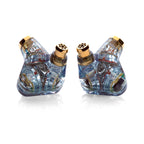 Campfire Trifecta 'Astral Plane' - Flagship IEM showing translucent blue housing with gold accents on white background