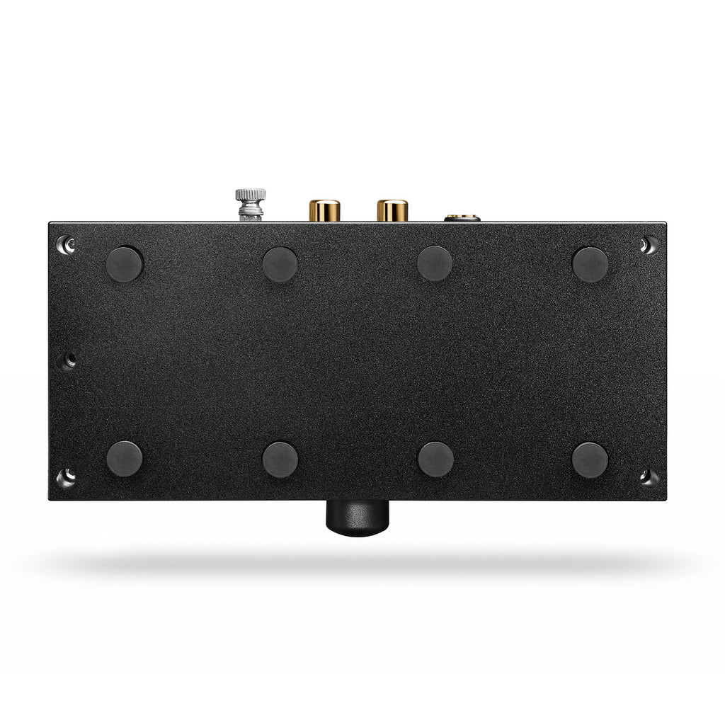 Bottom view of the Chord Anni Desktop Amplifier showing rubber feet and rear audio connectors on white background