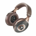 Focal Clear MG Open-Back Headphone with perforated ear pads and metallic honeycomb grille in bronze finish on white background